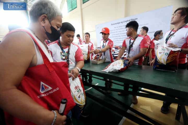 LOOK: Long lines formed as people rush to purchase P29 per kilo rice at the launch of the "Murang Bigas sa NIA at P29" program at the NIA headquarters in Quezon City on 8 August 2024. This project supports President Ferdinand Marcos Jr.'s goal of ensuring food security and boosting the country's economy.